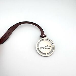Nicole Miller Silver Logo Pendant with Brown Leather Hang Tag for Handbag